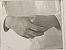 Close-up photograph of the final resting hand position for Mem.