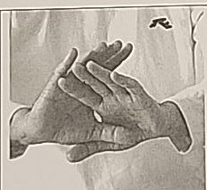 Close-up photograph of the hand position for Mem, fingers overlapping.